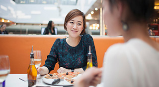woman eating out with friends